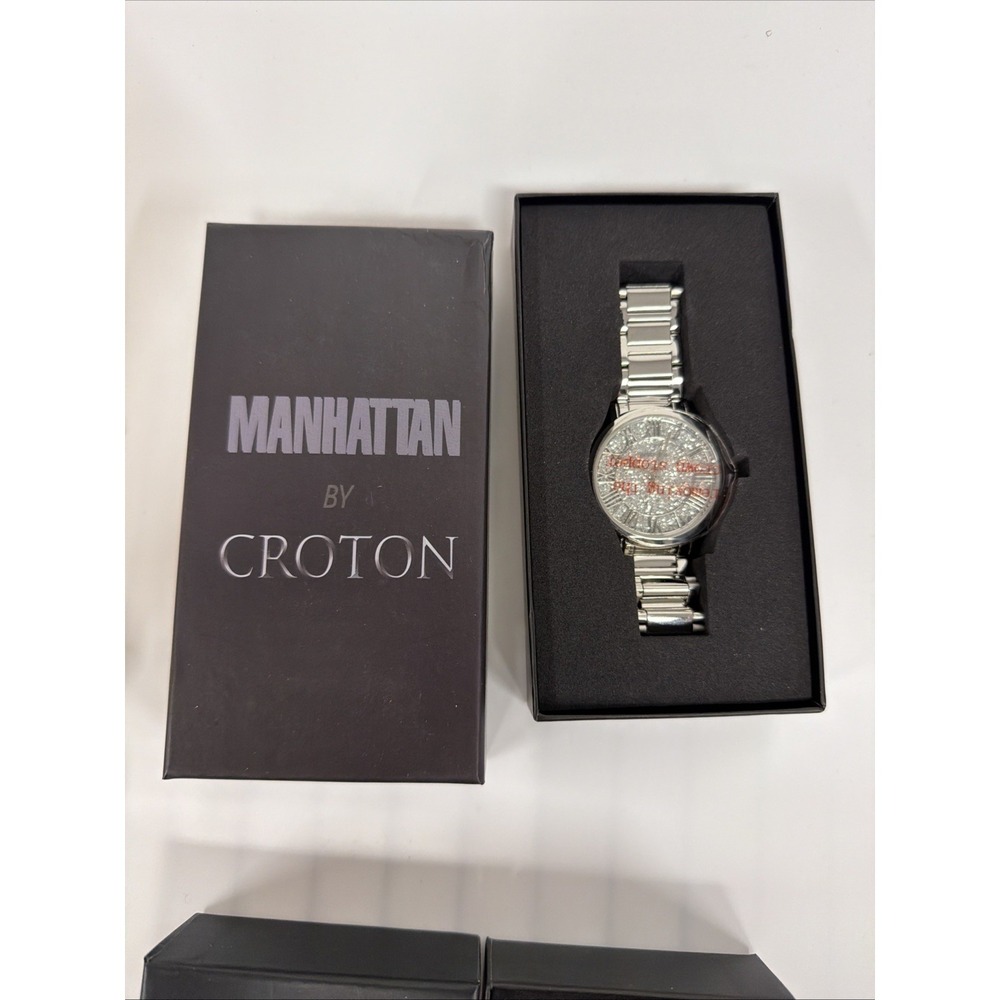 Manhattan by Croton wristwatch features a silver-tone metal band